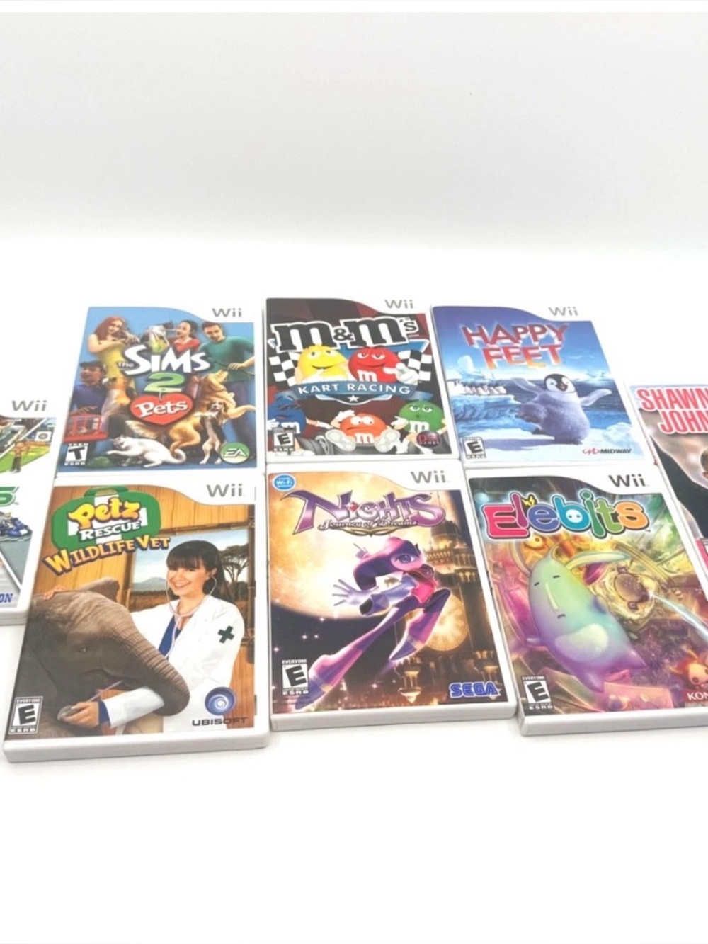 LOT OF 8 Nintendo Wii Games Nights - Sims - Sports - Preowned Condition
